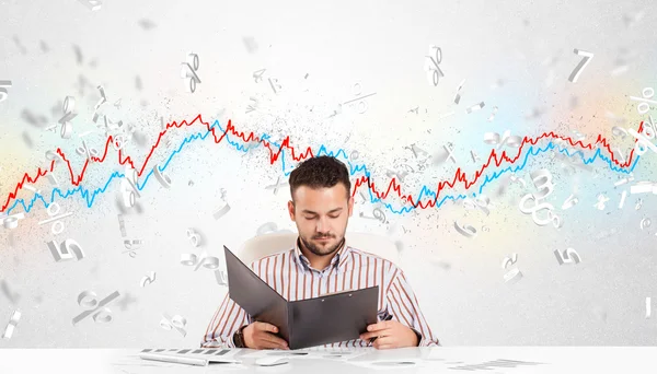 Business man sitting at table with stock market graph — Stock Photo, Image
