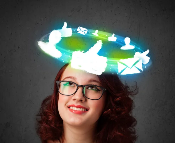 Young teenager with cloud social icons around her head — Stock Photo, Image