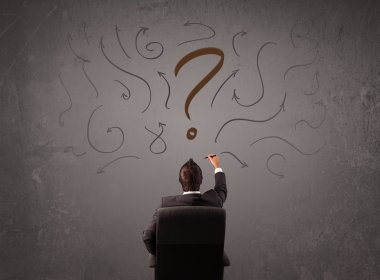 İş adamı soru işareti skecine bakıyor.