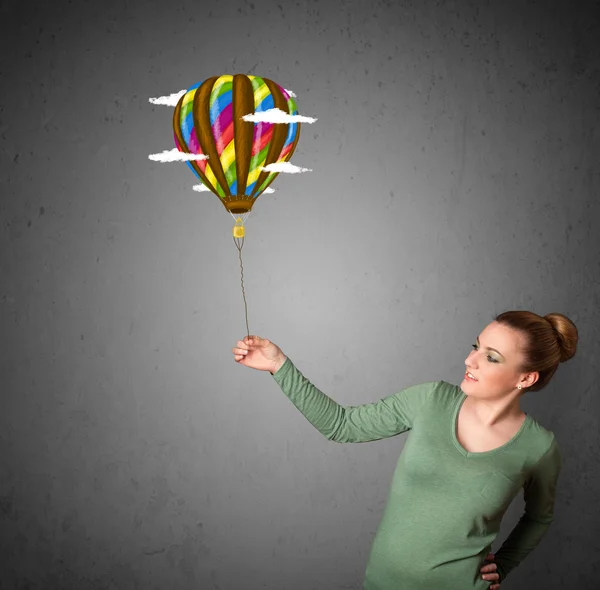 Žena drží balon výkresu — Stock fotografie