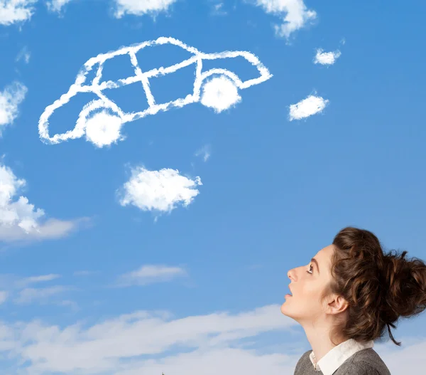 Young girl looking at car cloud on a blue sky — Stock Photo, Image