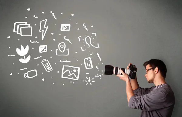 Photographer boy capturing white photography icons and symbols — Stock Photo, Image