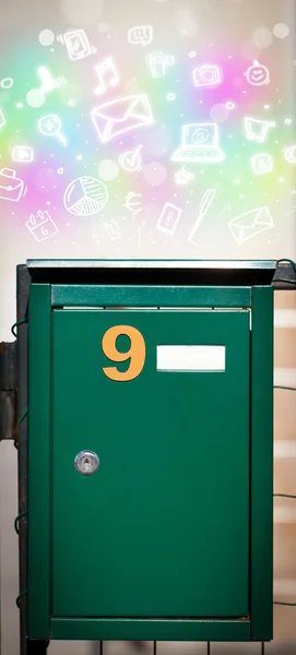 Colorful icons and symbols bursting out of a mailbox — Stock Photo, Image