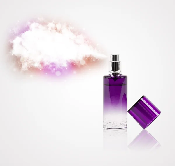 Beautiful bottle spraying colorful cloud — Stock Photo, Image