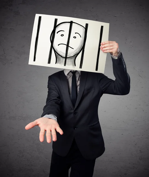 Businessman holding a paper with a prisoner behind the bars on i — Stock Photo, Image