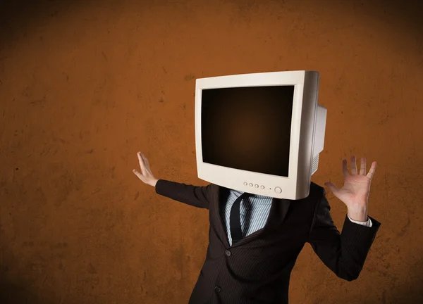 Business man with a monitor on his head and brown empty space — Stock Photo, Image