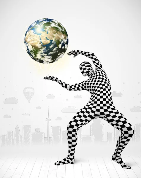 Man in full body suit holding planet earth — Stock Photo, Image