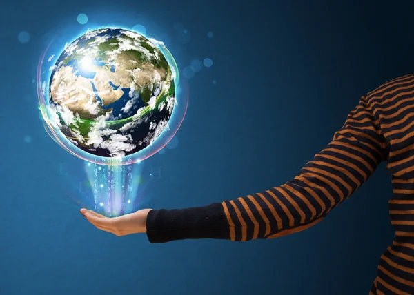 Woman holding a glowing earth globe — Stock Photo, Image