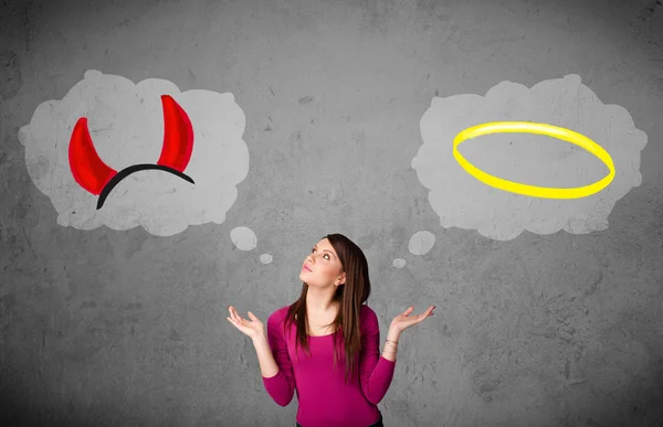 Woman choosing between good and bad — Stock Photo, Image