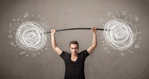 Muscular man lifting chaos concept — Stock Photo, Image