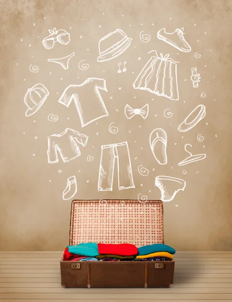 Utazó poggyász kézzel rajzolt ruhák és ikonok — Stock Fotó