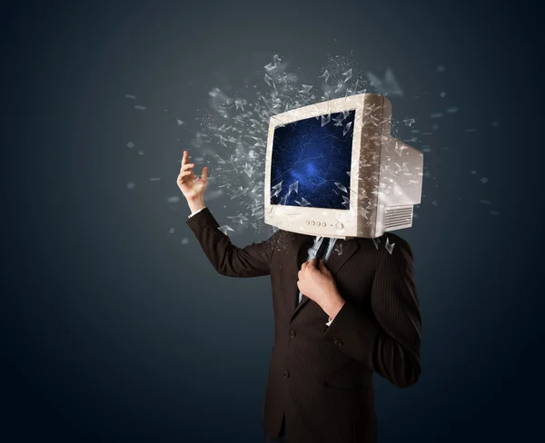 电脑屏幕在一个年轻人头上爆炸 — 图库照片