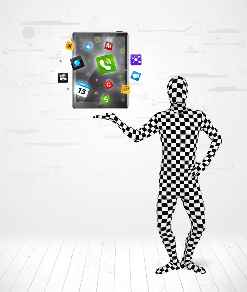 Man in full body suit holdig tablet pc — Stock Photo, Image