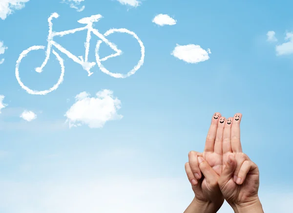 นิ้วยิ้มที่มีความสุข มองไปที่เมฆรูปจักรยาน — ภาพถ่ายสต็อก
