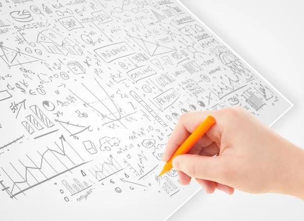 Lidská ruka kreslí nápady na bílém papíru — Stock fotografie
