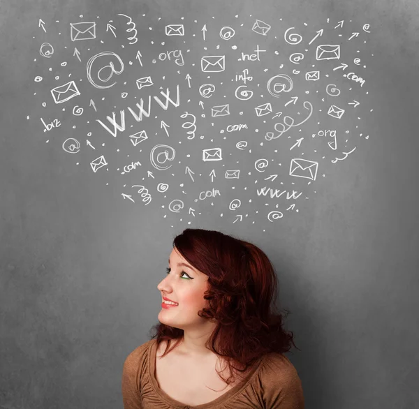 Young woman thinking with social network icons above her head — Stock Photo, Image