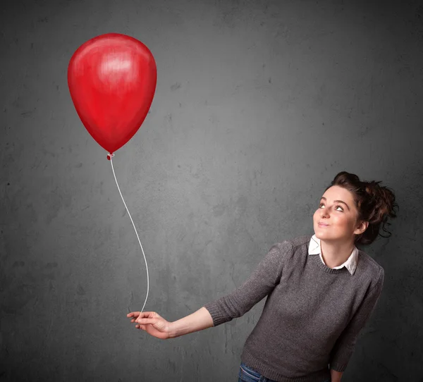 Frau mit rotem Luftballon — Stockfoto