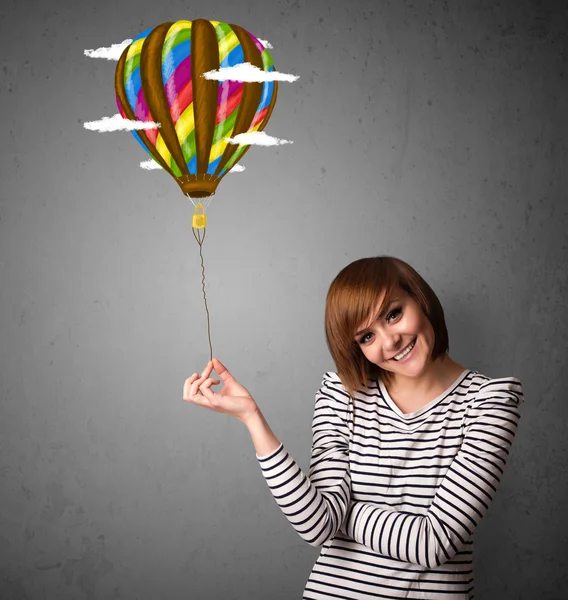 Woman holding a balloon drawing — Stock Photo, Image