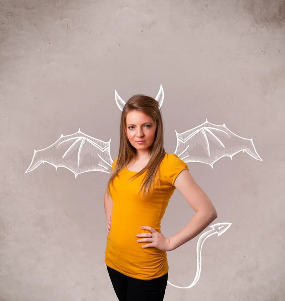 Young girl with devil horns and wings drawing — Stock Photo, Image