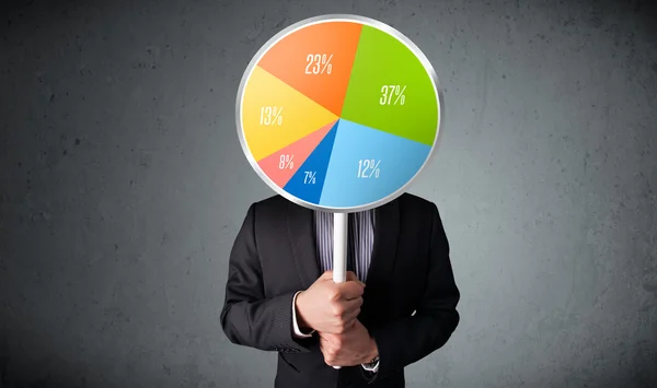 Businessman holding a pie chart — Stock Photo, Image