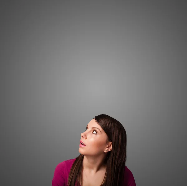 Thoughtful young woman gesturing with copy space — Stock Photo, Image