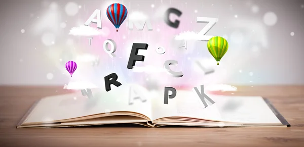 Open boek met vliegende 3d letters op betonnen achtergrond — Stockfoto