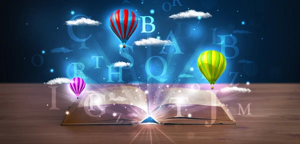 Open book with glowing fantasy abstract clouds and balloons — Stock Photo, Image