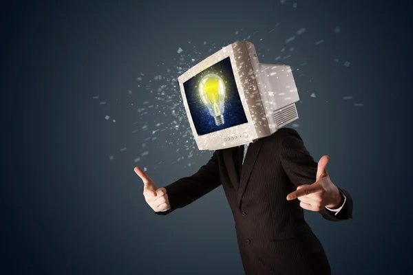 Business man with a pc monitor head and idea light bulb in the d — Stock Photo, Image