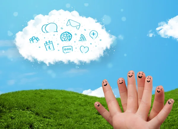 Happy smiley fingers looking at cloud with blue social icons and — Stock Photo, Image