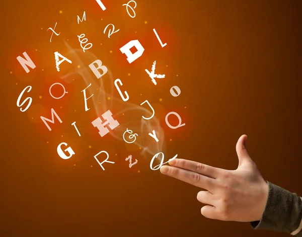 Letters coming out of gun shaped hands — Stock Photo, Image