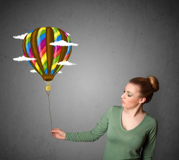 Woman holding a balloon drawing — Stock Photo, Image