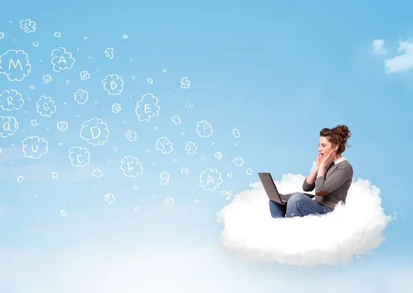 Young woman sitting in cloud with laptop — Stock Photo, Image