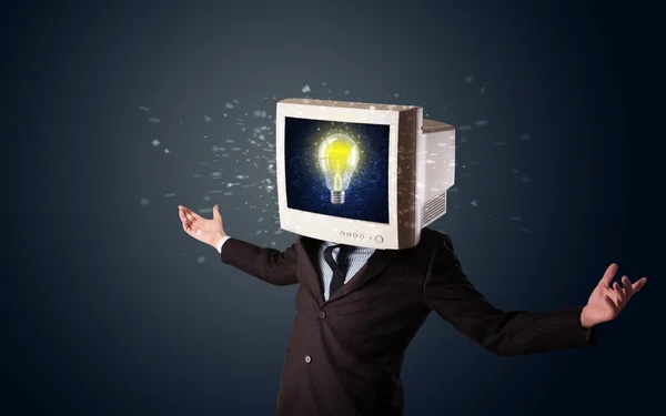 Business man with a pc monitor head and idea light bulb in the d — Stock Photo, Image