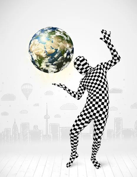 Man in full body suit holding planet earth — Stock Photo, Image