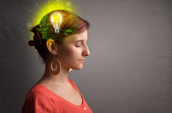 Young mind thinking of green eco energy with lightbulb — Stock Photo, Image