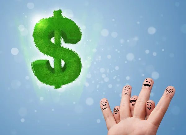 Happy smiley fingers looking at green leaf dollar sign — Stock Photo, Image