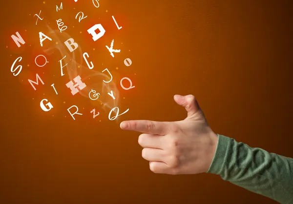 Letters coming out of gun shaped hands — Stock Photo, Image