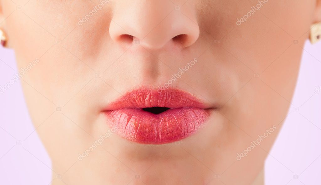 Beautiful woman red lips close up 