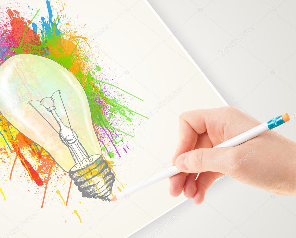 Hand drawing on paper a colorful splatter lightbulb 