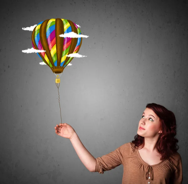 Woman holding a balloon drawing — Stock Photo, Image