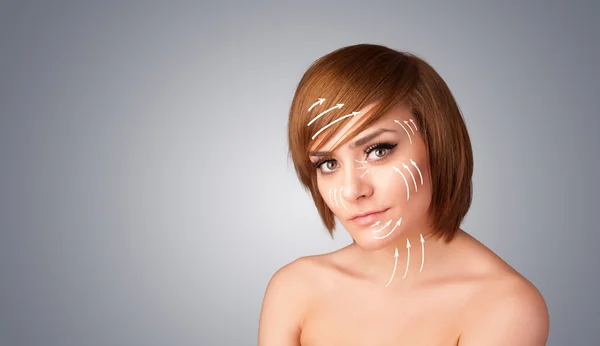 Beautiful girl with facial arrows on her skin — Stock Photo, Image