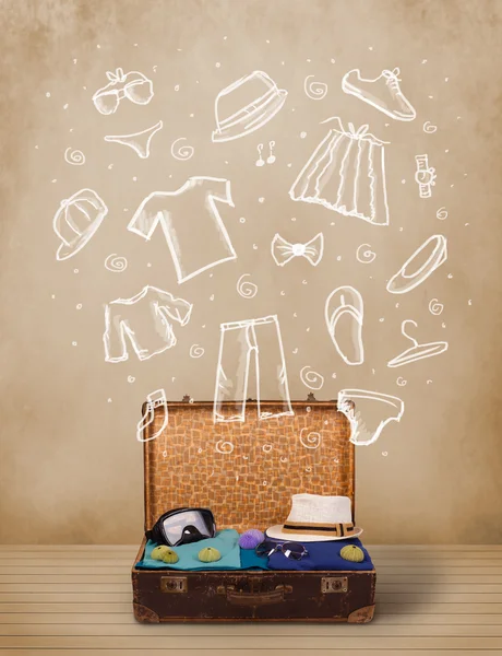 Traveler luggage with hand drawn clothes and icons — Stock Photo, Image