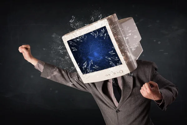 Computer monitor screen exploding on a young persons head — Stock Photo, Image