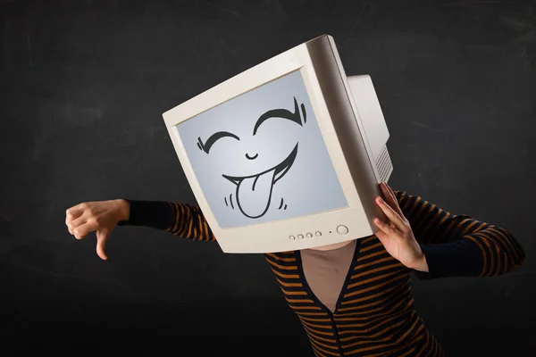 Young girl wearing a monitor with a funny face — Stock Photo, Image