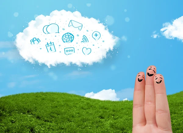 Happy smiley fingers looking at cloud with blue social icons and — Stock Photo, Image