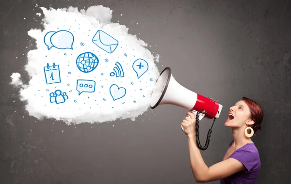 Woman shouting into loudspeaker and modern blue icons and symbol — Stock Photo, Image