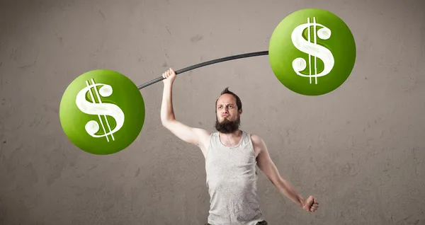 Skinny guy lifting green dollar sign weights — Stock Photo, Image