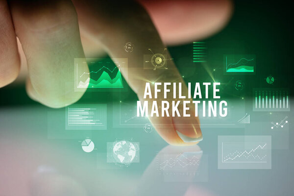 Finger touching tablet with business graphs and icons concept