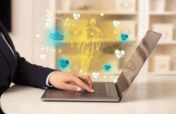 Doctor working on laptop with healthcare concept — Stock Photo, Image