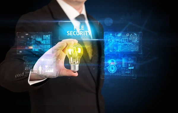 Businessman holding a light bulb, online security concept — Stock Photo, Image